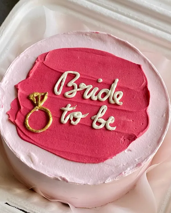 A "Bride to be" bento cake, perfect for a bridal shower or bachelorette party. These mini cakes are a great way to celebrate personal milestones in a sweet and intimate way.