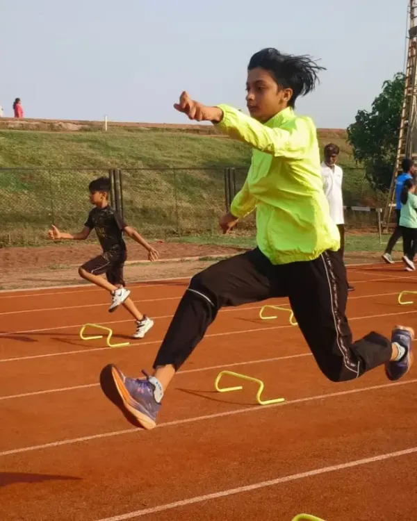 This is the moment it all comes together. The training, the focus, and the determination, captured in a single leap. My coaching focuses on perfecting this kind of form for hurdle events.