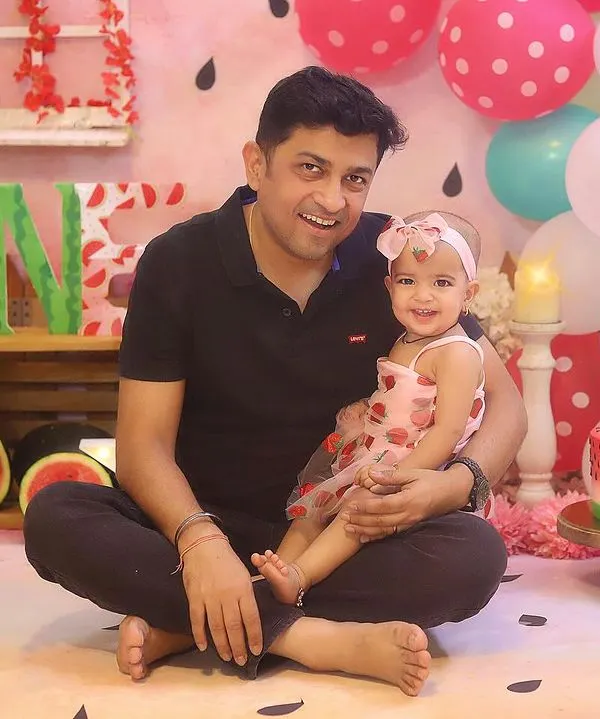 A precious father-daughter moment during the "One in a Melon" birthday shoot.