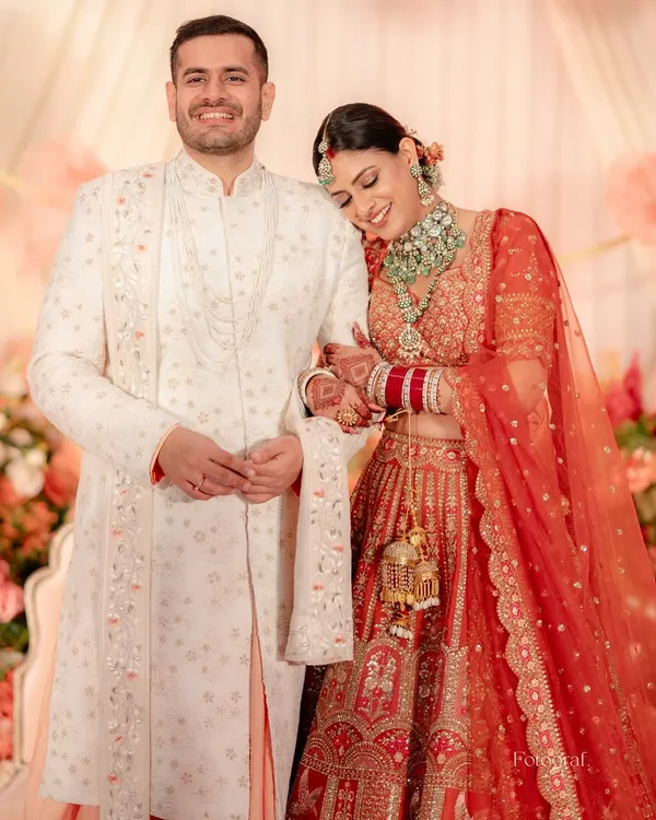 A beautiful portrait of the newlyweds, with the bride resting her head on the groom's shoulder, radiating contentment and love.