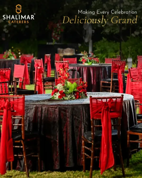We transform outdoor spaces into grand dining venues. This setup features our classic red and black theme, with elegant chair dressings and floral centerpieces that create a dramatic and celebratory mood.