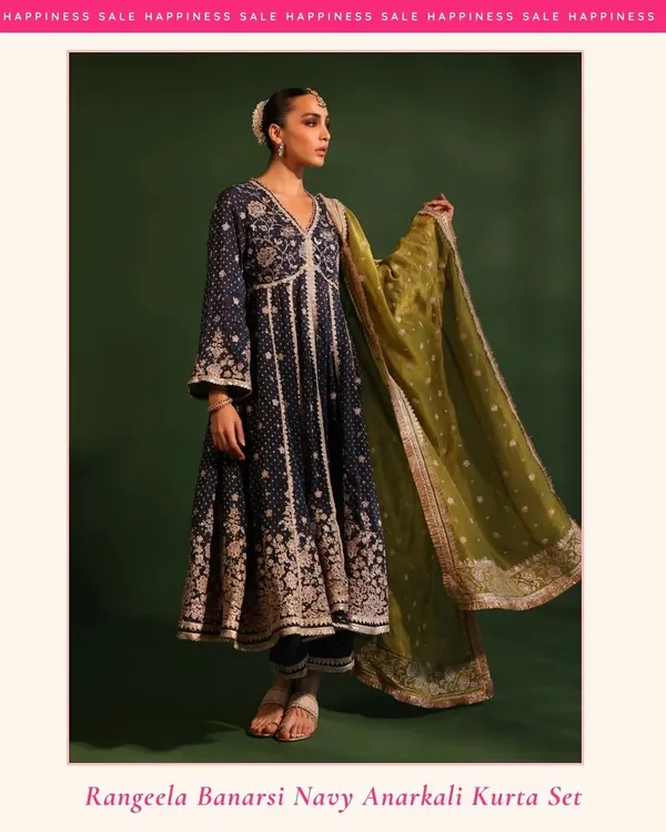 This is elegance, bottled. My Rangeela Banarsi Navy Anarkali is for when you want to make an entrance. The rich navy blue fabric paired with the contrasting olive green organza dupatta is perfect for a wedding reception or a formal evening event.