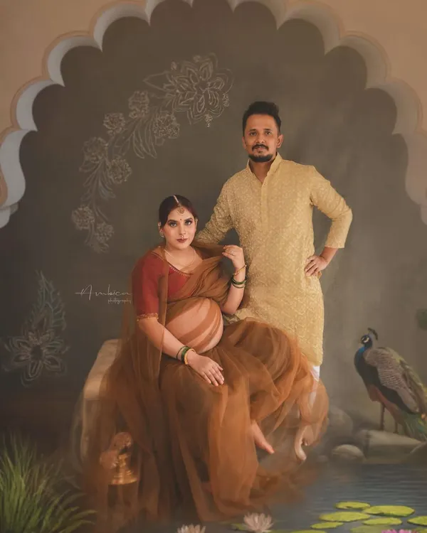 Celebrating the journey together. This painterly portrait features the couple in a setting inspired by Indian royalty, complete with a peacock and intricate architectural details. It shows how we can weave your shared story into a piece of fine art.