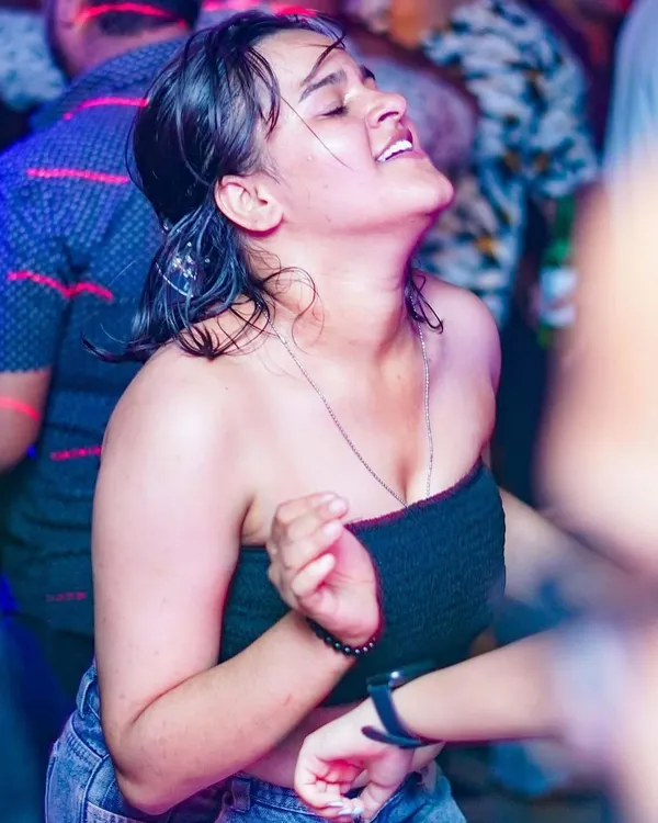 This is what it's all about. A partygoer completely lost in the music, feeling every beat. Capturing these moments of pure joy is the best part of my job.