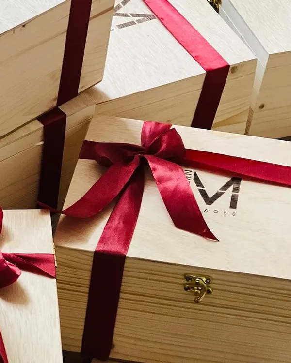 This is what I love to see, a large order of custom-branded wooden gift boxes ready for dispatch. Each box features a laser-engraved logo and is finished with an elegant satin ribbon, showcasing a premium corporate gifting experience.