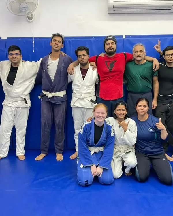 A fantastic group photo after a tough but rewarding training session. You can see a mix of gi and no-gi practitioners, all part of the same supportive martial arts family.