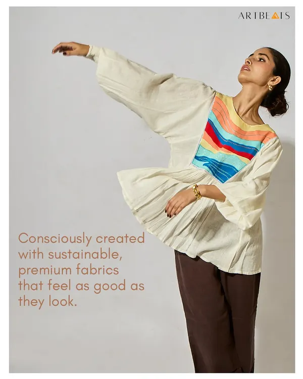 Consciously created with sustainable, premium fabrics that feel as good as they look. This image of the Seascape Frill Top in motion captures the life and breath of my designs.