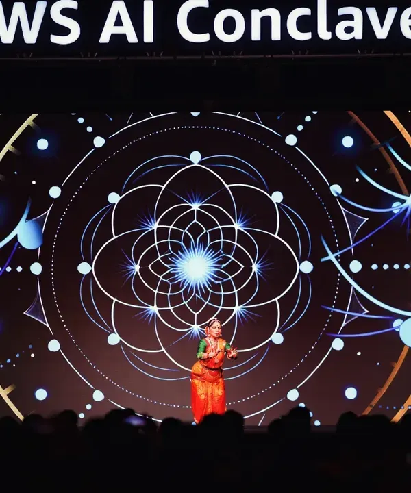 A moment from 'Fusion of Epochs' at the AWS AI Conclave. This performance was a symphony of Bharatanatyam and Generative AI, where my dancer's avatar was created live on stage, exploring the harmony between human artistry and technological innovation.