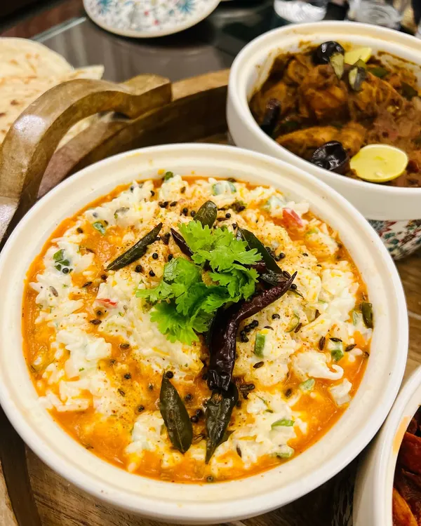 A comforting bowl of South Indian curd rice, tempered with spices and curry leaves. It's the perfect accompaniment to my spicy Prawn Ghee Roast or Chicken Chettinad.