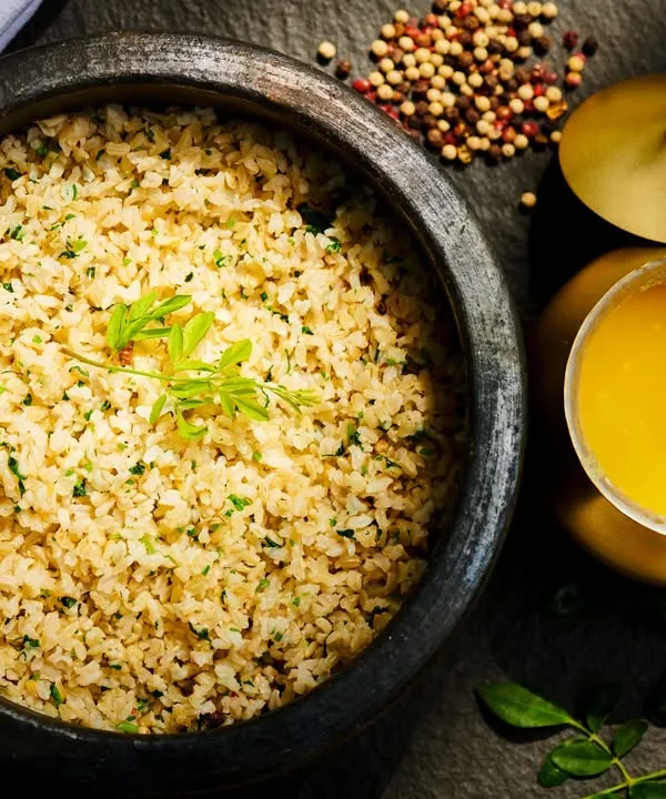 A bowl of simplicity, a spoonful of healing. This is our broken rice with a drizzle of golden ghee, a nourishing and easily digestible meal that comforts the gut and balances the doshas, forming a staple of our Ayurvedic diet.