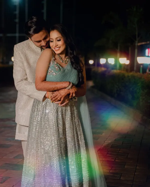 A romantic embrace during a night shoot. I used a prism to create the rainbow light flare, adding a touch of magic and dreaminess to this otherwise classic portrait.