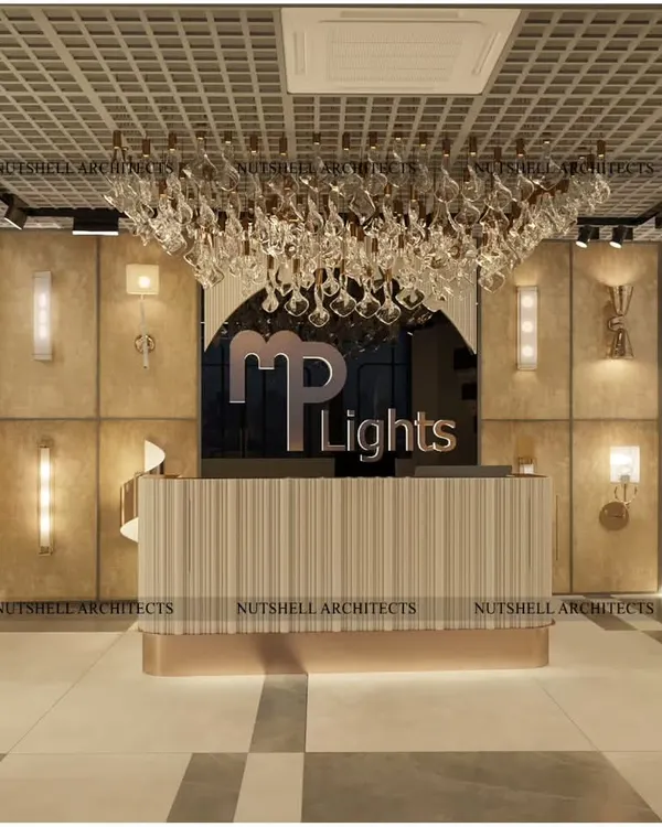 The reception area of the MP Lights showroom sets a tone of modern elegance. A stunning chandelier hangs over the bespoke desk, with various wall lights displayed on a textured backdrop, immediately immersing customers in the world of lighting.