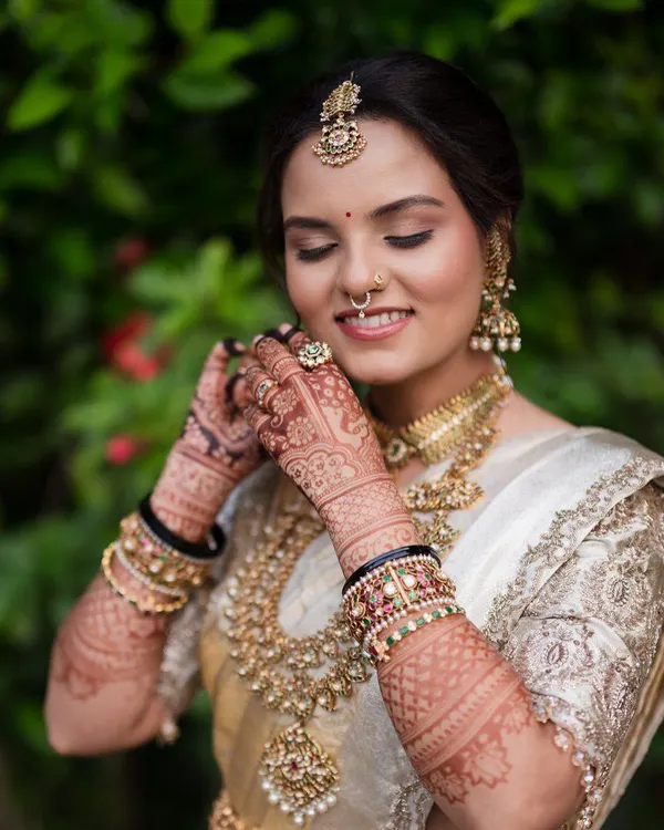 The final look is everything. Here you can see how the rich henna stain complements the bride's stunning wedding attire, adding a layer of tradition and elegance to her special day.