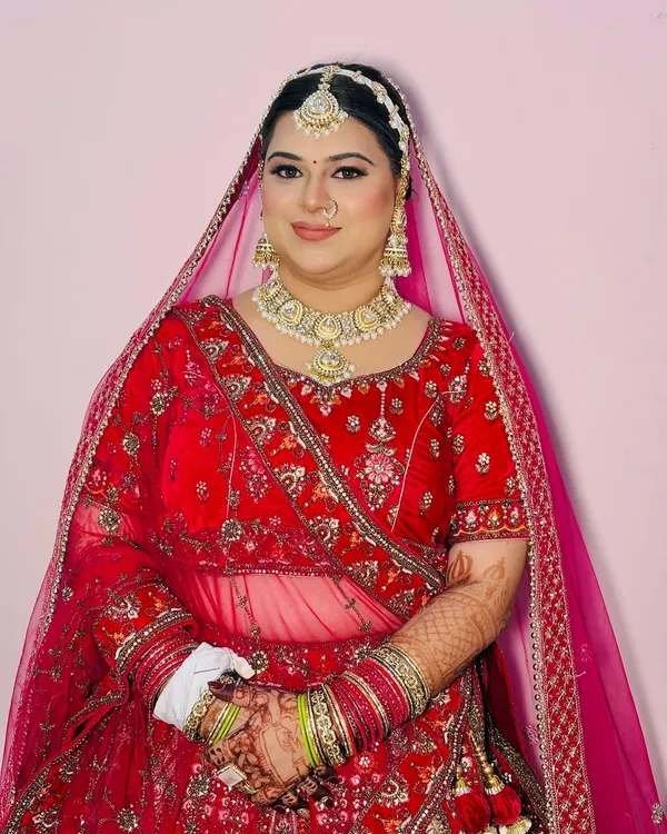 A radiant bride ready for her wedding ceremony. I created this classic look with soft-focus HD makeup, a traditional matha patti, and a nose ring to enhance her beautiful features.