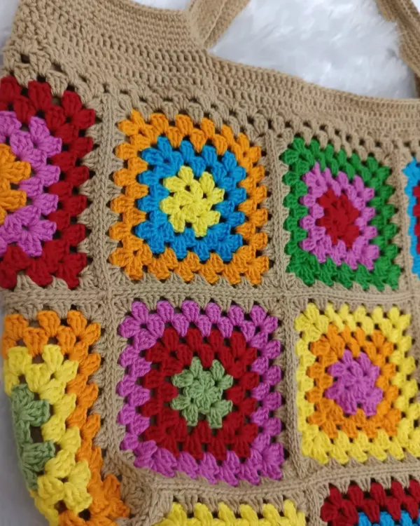 This colorful granny square tote is one of my favorite things to make. I use 100% cotton yarn for durability and love picking out bright, happy color combinations that make the bag truly unique.