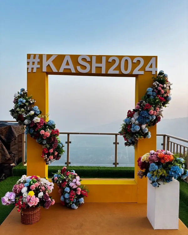 We create personalized, Instagram-worthy photo opportunities for you and your guests. This custom selfie booth, featuring the couple's wedding hashtag against a breathtaking mountain view, becomes a memorable focal point of the celebration.