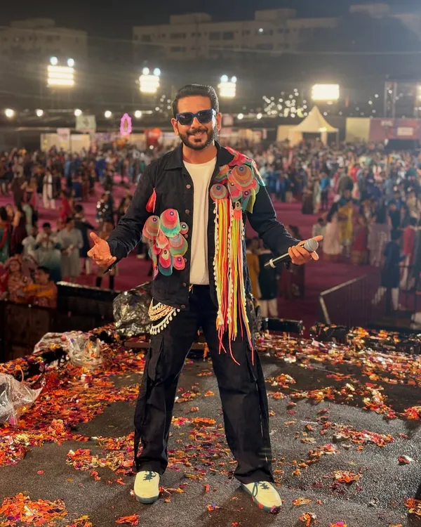 On stage at Rangraas Navratri, surrounded by confetti and a massive crowd. This is what a festival finale looks like, pure jalsa and celebration.