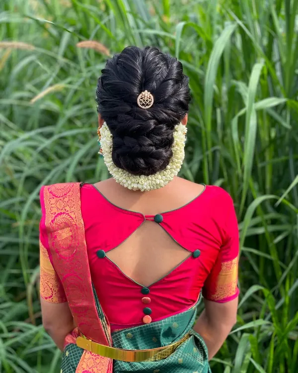 A beautiful braided updo for Vanitha for her housewarming ceremony. This elegant hairstyle is perfect for a guest who wants to look polished and festive.