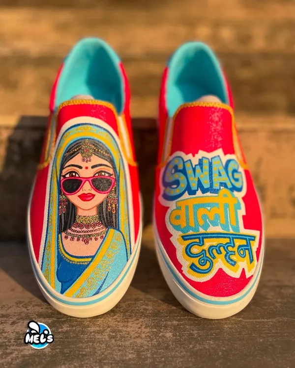 Custom kicks for a bride with swag. We hand-painted these bright pink slip-on sneakers with a cool bride illustration and the Hindi text "Swag Wali Dulhan" for a fun and unique wedding accessory.