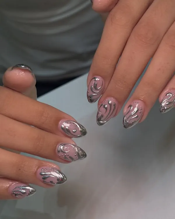 A closer look at the liquid metal effect of this chrome nail art. I carefully hand-paint the swirls over a sheer nude base to create depth and a floating effect.