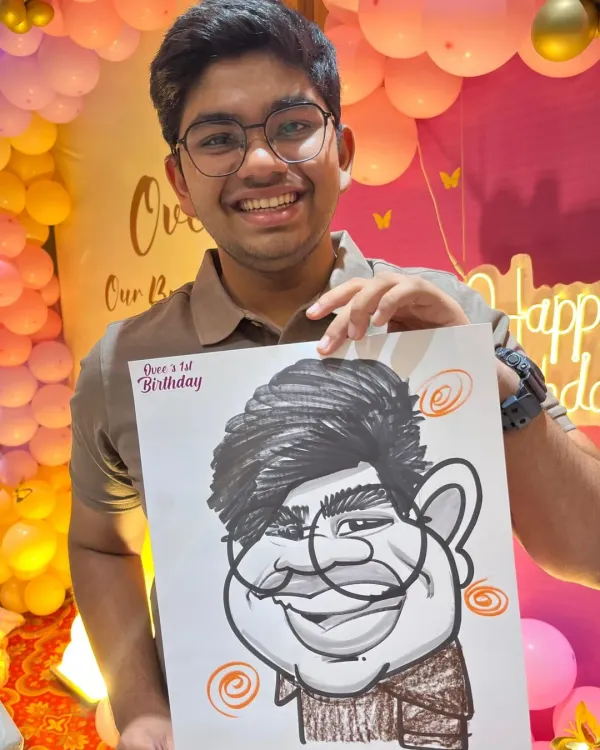 A guest at Ovee's first birthday party, set against a beautiful balloon backdrop. My caricatures add a personal touch to any party's decor and theme.