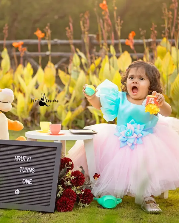 A whimsical first birthday tea party in the park. We bring everything needed, from the tiny tea set to the celebratory sign, to create a storybook scene for your child.