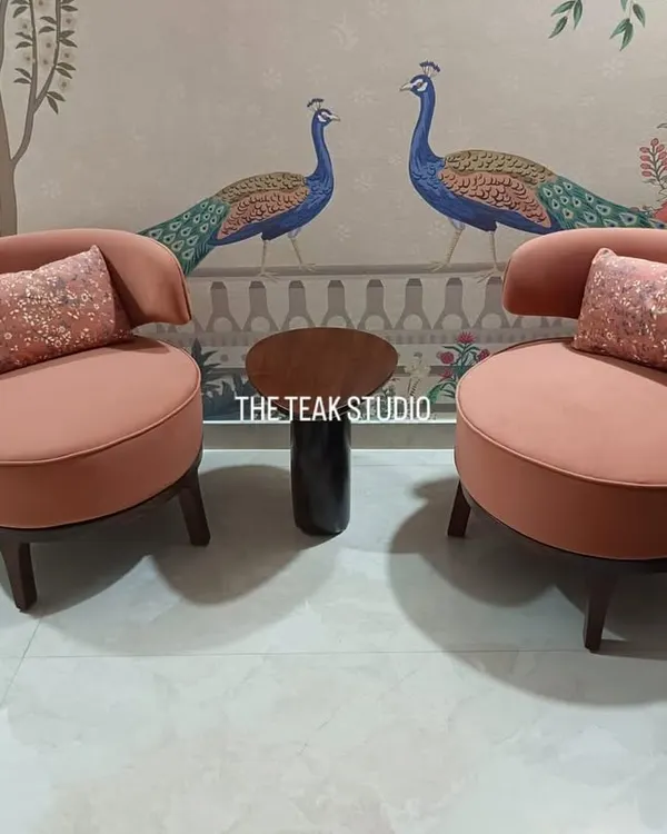 We love how these custom-made accent chairs in a dusty rose fabric turned out. Paired with sequined cushions and set against a beautiful peacock mural, they create a charming and elegant seating nook.