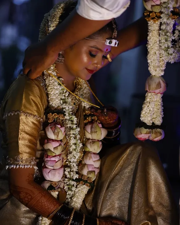 A quiet, emotional moment during the wedding ceremony. My long lasting, water resistant makeup ensures the bride looks flawless even through happy tears and hours of rituals.
