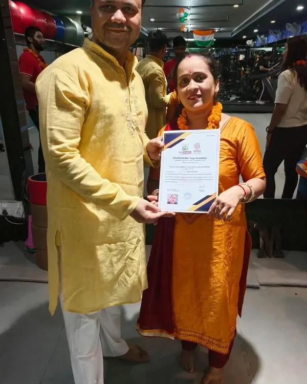 This is the moment all the hard work leads to. I am proud to present a new, certified yoga teacher with her Yoga Alliance certificate. This is the goal of our journey together.