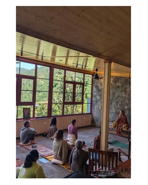 The completed meditation space in use, fulfilling its purpose as a center for stillness and reflection. The design, with its natural light and views, creates a tranquil atmosphere for guests.