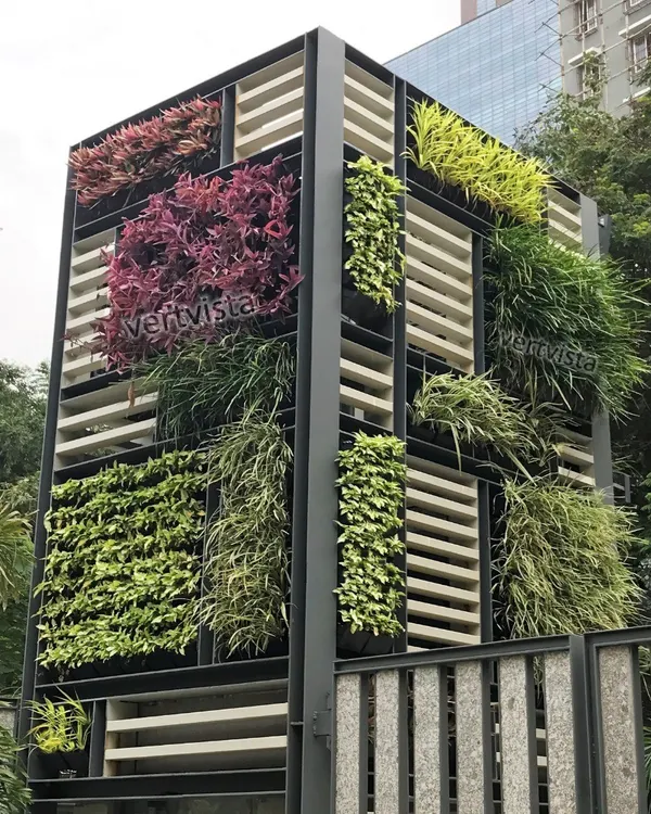 For spaces where a traditional wall isn't an option, we design freestanding vertical garden structures. This installation acts as an architectural feature, using different plant varieties in a block pattern to create a living, breathing sculpture.