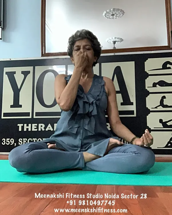 Here I am practicing a form of pranayama, or breath control. Focusing on the breath is the quickest way to center the mind and is a skill we will develop for labor preparation.