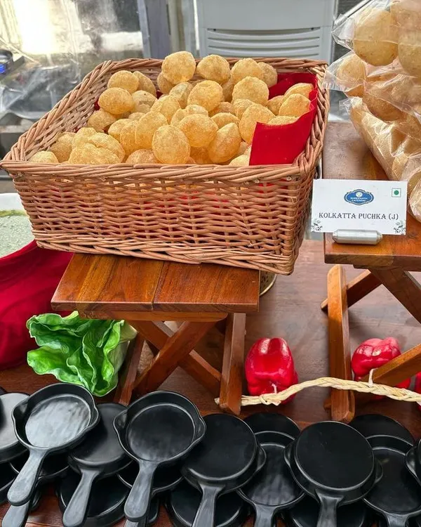 A classic Indian street food favorite, Puchka (Pani Puri), ready to be served. We present it with all the traditional accompaniments for an authentic experience.