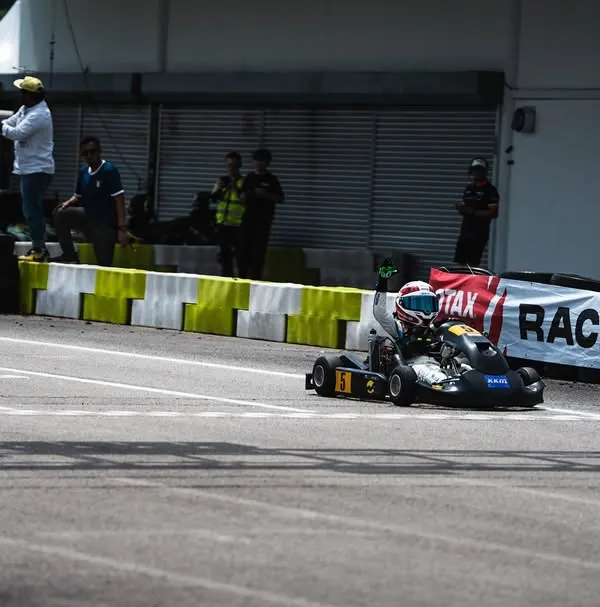 Our driver crosses the finish line at the RMC Asia Trophy at Sepang, representing India on the international stage.