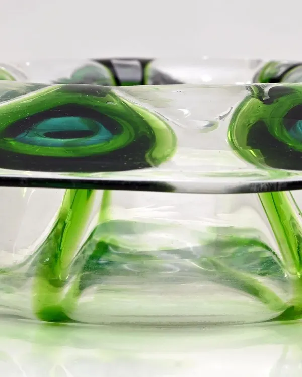 This Bohemian glass bowl, decorated with a 'Peacock Feather' pattern after a design by Loetz, was the lead lot in my 'Ostentatious Peacocks' auction. The inverted capstan form and vibrant green glass make it a stunning decorative piece.