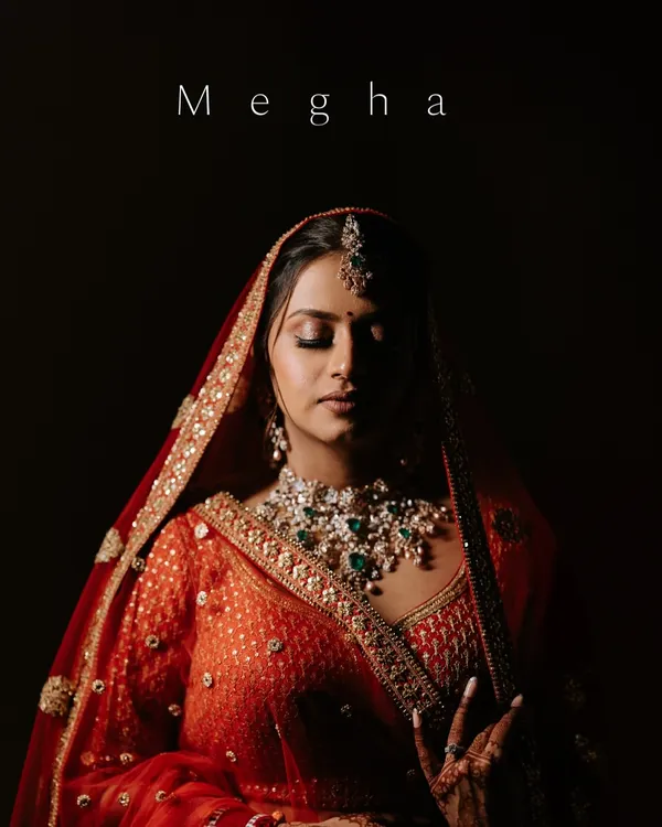 A breathtaking bridal portrait. The dramatic lighting and her serene expression create a powerful and timeless image, capturing the essence of her beauty on her wedding day.