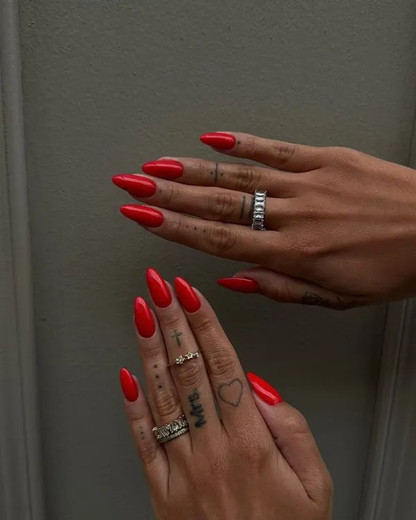A classic, bold red on sharp stiletto nails. This look is confident, powerful, and always makes a statement.
