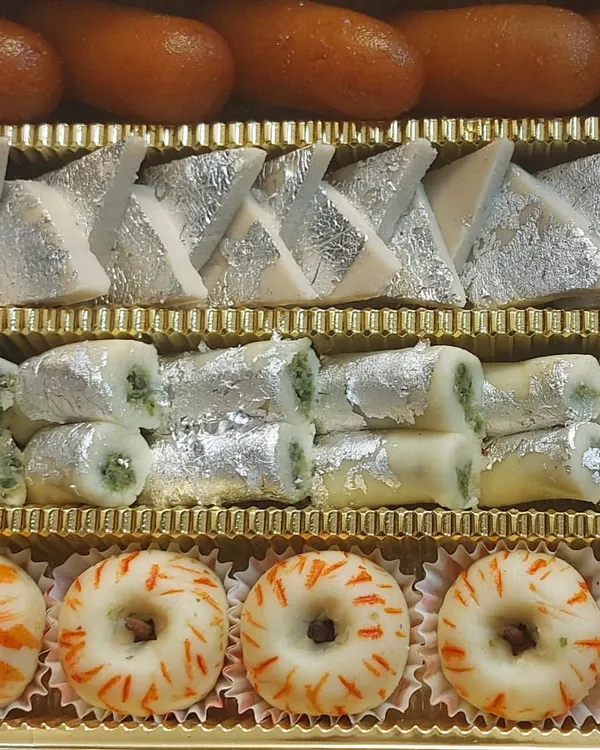 Our assorted mithai box is perfect for gifting or celebrating any occasion. This one includes a vibrant mix of our bestsellers like Kaju Katli, Pista Rolls, and decorative sandesh, all handcrafted in our kitchen.