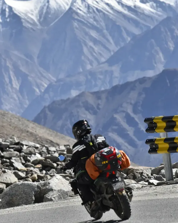 A moment of pure awe on our Dominar, dwarfed by the immense scale of the Himalayan mountains. This is what our long-distance motorcycle expeditions are all about: finding epic views and pushing our limits.