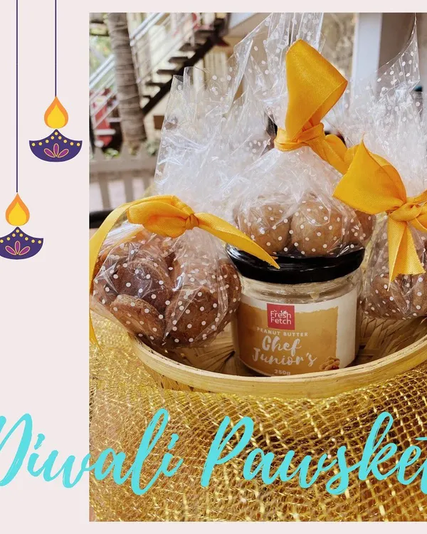 Our Diwali 'Pawsket' beautifully arranged. It includes a jar of peanut butter and bags of our two different cookie flavors, all ready for gifting.