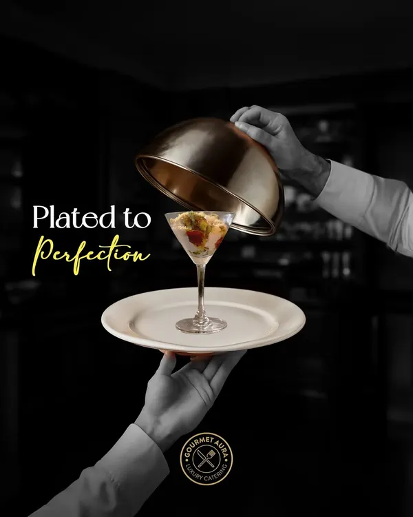 "Plated to Perfection." A server unveils a stunning dish in a martini glass, a symbolic representation of our commitment to elegant presentation and service.