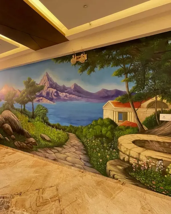A beautiful landscape mural painted for a residence at Land Trades Solitaire in Mangalore. This artwork creates a window to a serene, imaginary world, making the room feel larger and more peaceful.