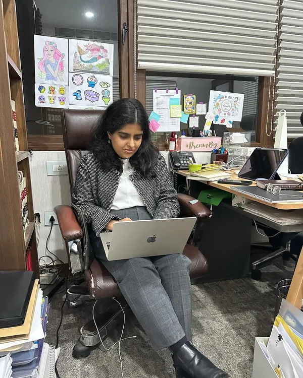 A candid moment at my desk, which is my very sacred, messy, and disorganized space. It's filled with case files, personal touches, and the focused energy of a litigator at work.