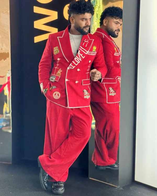 My custom red suit, designed to make a statement at the WOW Awards. The patches and embroidery reflect my personality.