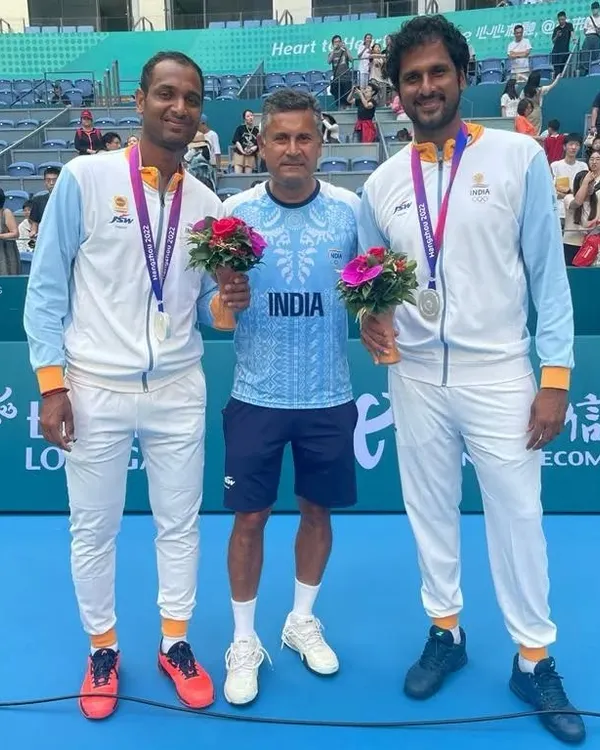 A proud moment for Indian tennis. I stand with our Asian Games silver medalists, Ramkumar Ramanathan and Saketh Myneni, after their hard-fought men's doubles final. This is the level of excellence we strive for at NTC.