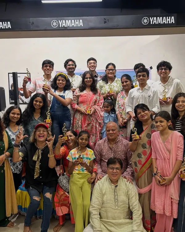 Our happy tribe. A group photo with all our performers and their trophies after a successful music event. This is the result of hard work, dedication, and a lot of taaliyan.