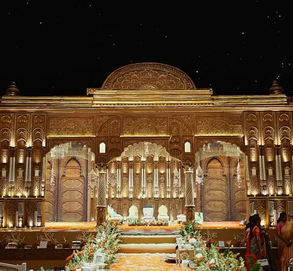 The full view of our South Indian wedding mandap, a 50-foot structure with every part intricately carved by artisans from Karnataka. This is tradition, elevated with our unique design language.