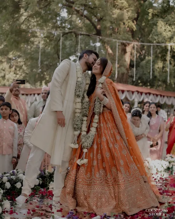In a shower of petals and blessings, this is the moment that feels like a pause in time. It’s the unscripted, heartfelt kiss during the ceremony that speaks volumes. I live for capturing these real, candid expressions of love that become the most cherished memories of your wedding day.