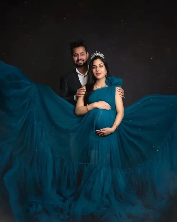 This is what pure magic looks like. I love creating these dreamy, dramatic portraits for couples, complete with a flowing gown and a touch of sparkle to celebrate the new life they are waiting for.