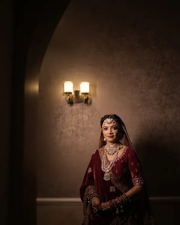 This is the quintessential royal bridal look. I used airbrush techniques to create a flawless, long-lasting base and focused on defining the eyes to match the grandeur of the velvet lehenga and polki jewellery. This look is perfect for the bride who wants to feel like a queen on her wedding day.